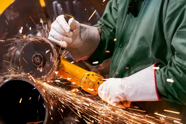 Worker sawing