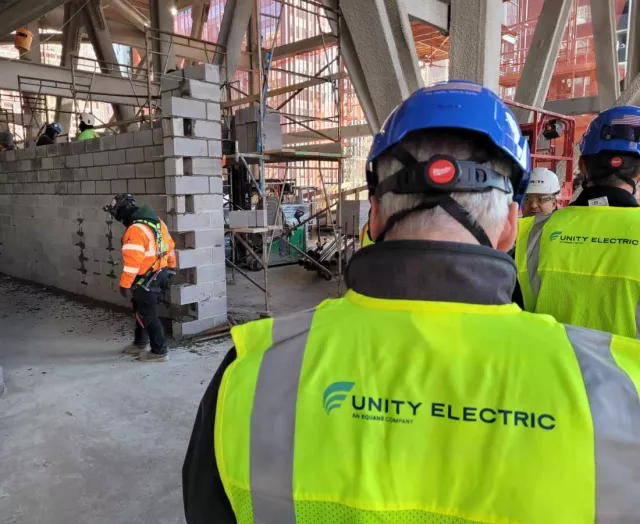 Unity Electric worker at construction building site
